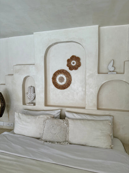 Décoration murale ronde en coquillages Cauri et Anadara – création artisanale de Bali